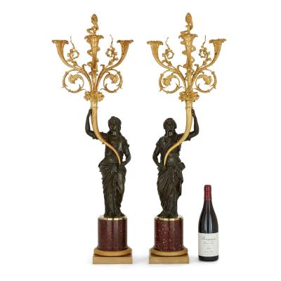 A pair of large French ormolu and patinated bronze candelabra
