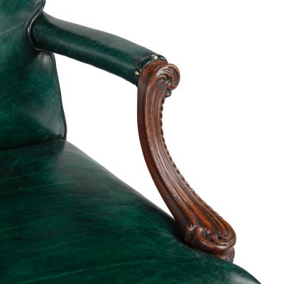 A pair of mahogany open armchairs in the style of Chippendale