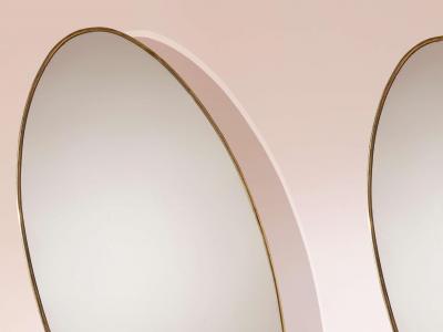 A pair of oval brass mirrors Italy 1960s