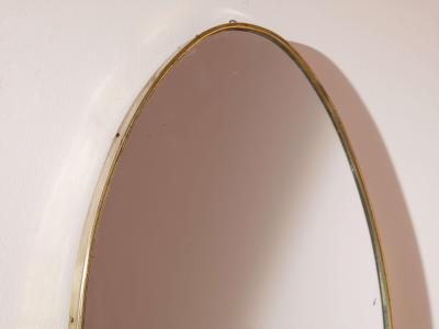 A pair of oval brass mirrors Italy 1960s