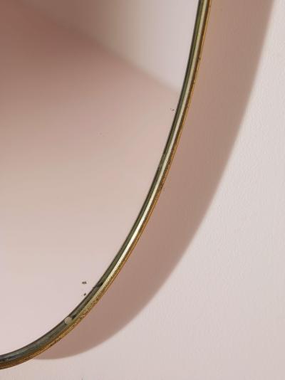 A pair of oval brass mirrors Italy 1960s