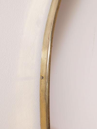 A pair of oval brass mirrors Italy 1960s