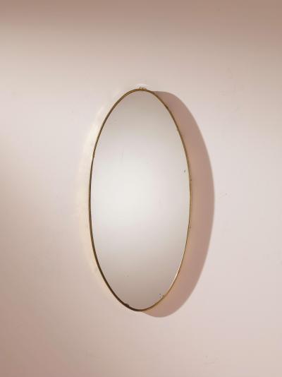 A pair of oval brass mirrors Italy 1960s