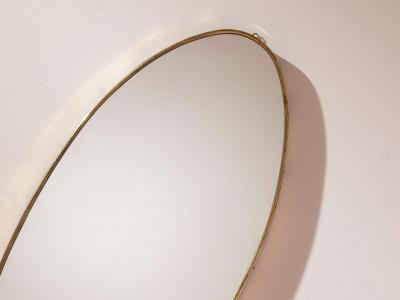 A pair of oval brass mirrors Italy 1960s