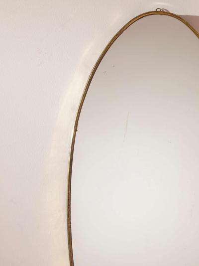 A pair of oval brass mirrors Italy 1960s