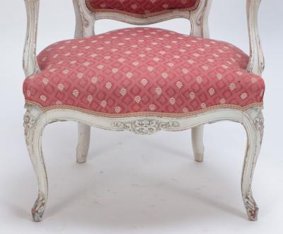 A pair of painted and carved French Louis XV style open arm chairs circa 1900 