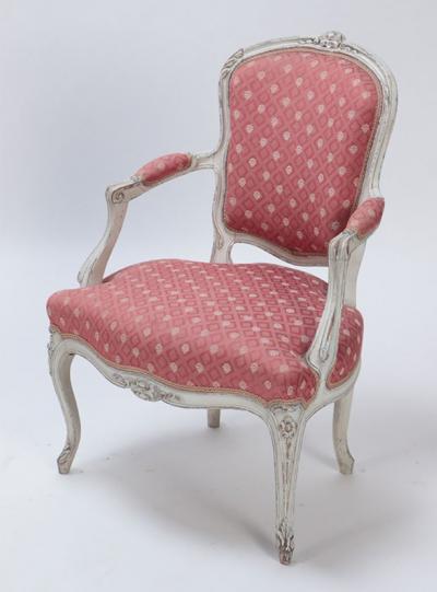 A pair of painted and carved French Louis XV style open arm chairs circa 1900 