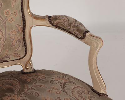 A pair of painted and giltwood French upholstered open armchairs Louis XV style
