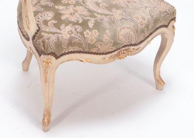 A pair of painted and giltwood French upholstered open armchairs Louis XV style