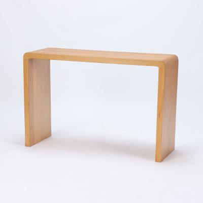 A pair of rounded cerused oak console tables Contemporary