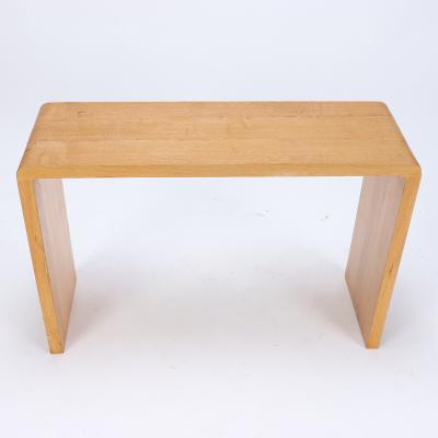 A pair of rounded cerused oak console tables Contemporary