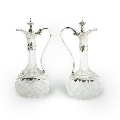 A pair of silver mounted crystal Royal presentation claret jugs