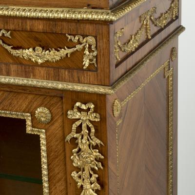 A pair of small Napoleon III kingwood display cabinets on stands