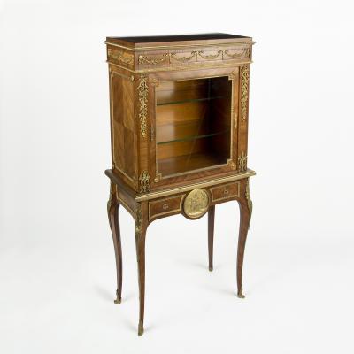 A pair of small Napoleon III kingwood display cabinets on stands