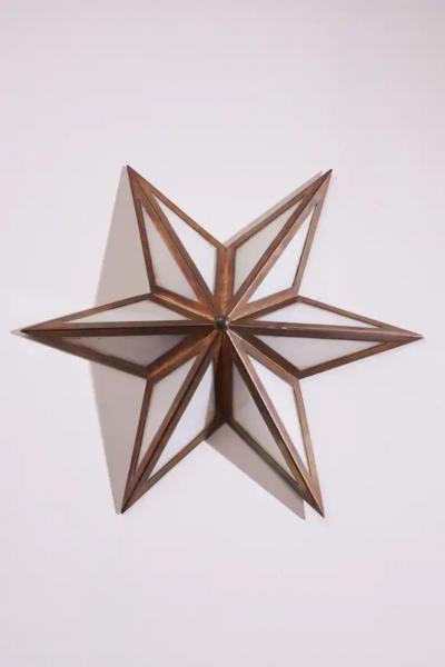 A pair of star shaped wall sconces made of brass and glass Italy 1960s