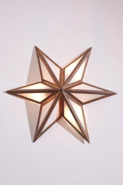A pair of star shaped wall sconces made of brass and glass Italy 1960s