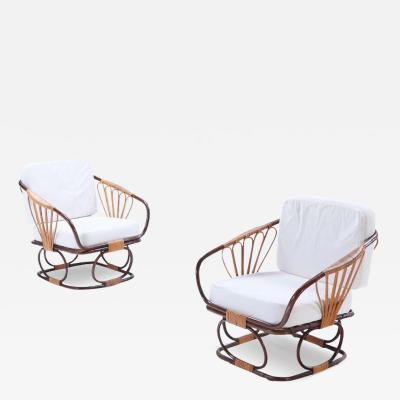 A pair of two tone French rattan chairs with cushions Circa 1970