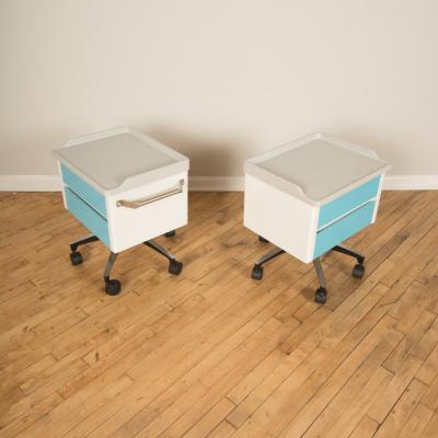 A pair of white and blue two drawers side cabinets on rolling base 1970s