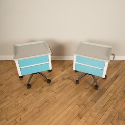 A pair of white and blue two drawers side cabinets on rolling base 1970s