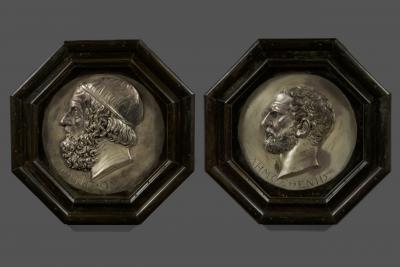 A pair silvered copper repouss circular bas relief portrait roundels