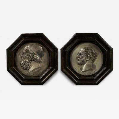 A pair silvered copper repouss circular bas relief portrait roundels