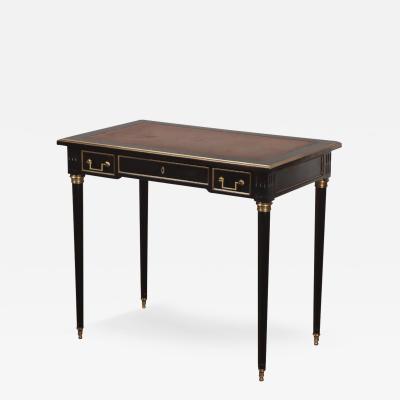 A petite French ebonized mahogany writing desk in the Louis XVI style C 1940 