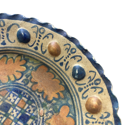 A rare Dutch Maiolica plate with checkerboard motif and oak leaves 17th century