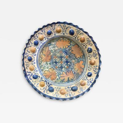 A rare Dutch Maiolica plate with checkerboard motif and oak leaves 17th century