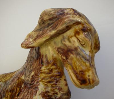 A rare English Yellow Ware figure of a hunting dog and hare