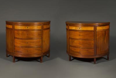 A rare pair of Frederick VI mahogany and satinwood inlaid demi lune commodes
