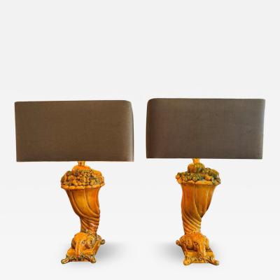 A rare pair of glazed ceramic leaning Rams table lamps