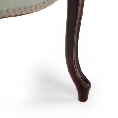 A rare set of twelve George III mahogany open arm chairs in the French Hepplewhi