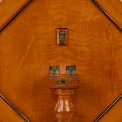 A satinwood hexagonal tilt top table