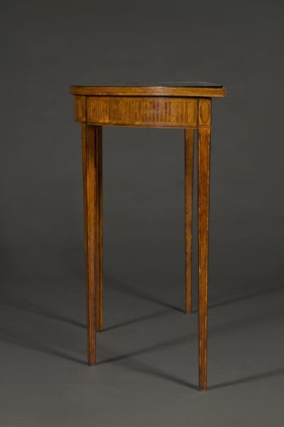 A satinwood tulipwood boxwood and ebony inlaid Demi Elliptical side table