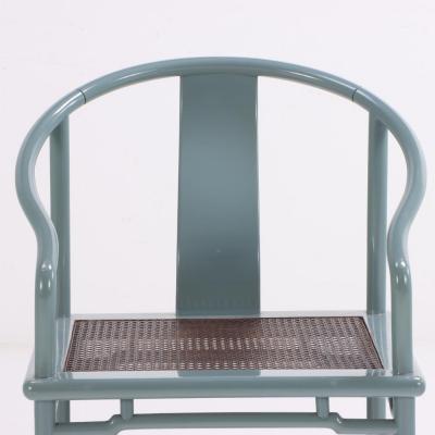 A set of 12 lacquered rounded back armchairs with cane seats C 1970 