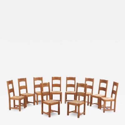 A set of 14 French oak ladderback dining chairs C 1960 
