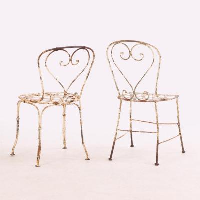 A set of 4 French iron garden chairs C 1950