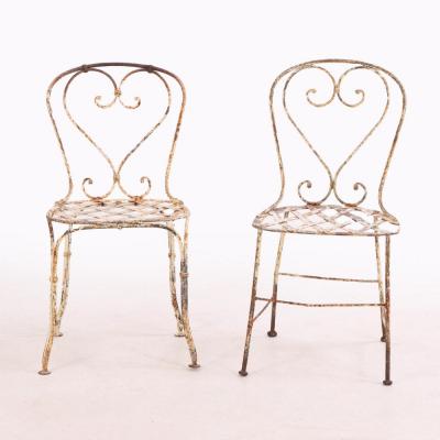 A set of 4 French iron garden chairs C 1950