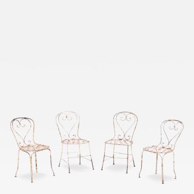 A set of 4 French iron garden chairs C 1950 