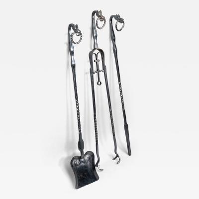 A set of Arts Crafts Cotswold School polished steel hand wrought fire utensils