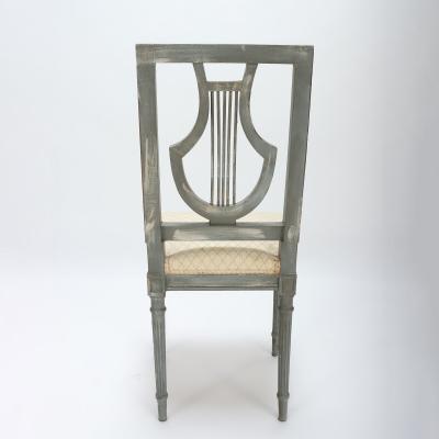 A set of four French Louis XVI style painted chairs Lyre model C 1900