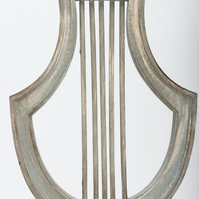 A set of four French Louis XVI style painted chairs Lyre model C 1900