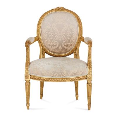 A set of four Louis XVI style giltwood fauteuils