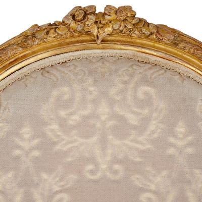 A set of four Louis XVI style giltwood fauteuils