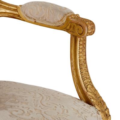 A set of four Louis XVI style giltwood fauteuils
