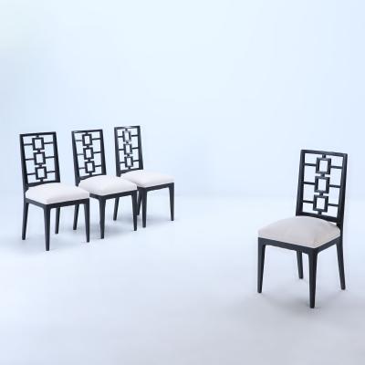 A set of four ebonized dining chairs in the manner of Parzinger circa 1950 