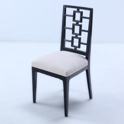 A set of four ebonized dining chairs in the manner of Parzinger circa 1950 