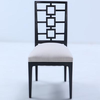 A set of four ebonized dining chairs in the manner of Parzinger circa 1950 