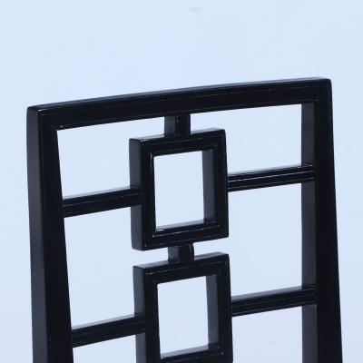 A set of four ebonized dining chairs in the manner of Parzinger circa 1950 