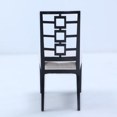 A set of four ebonized dining chairs in the manner of Parzinger circa 1950 